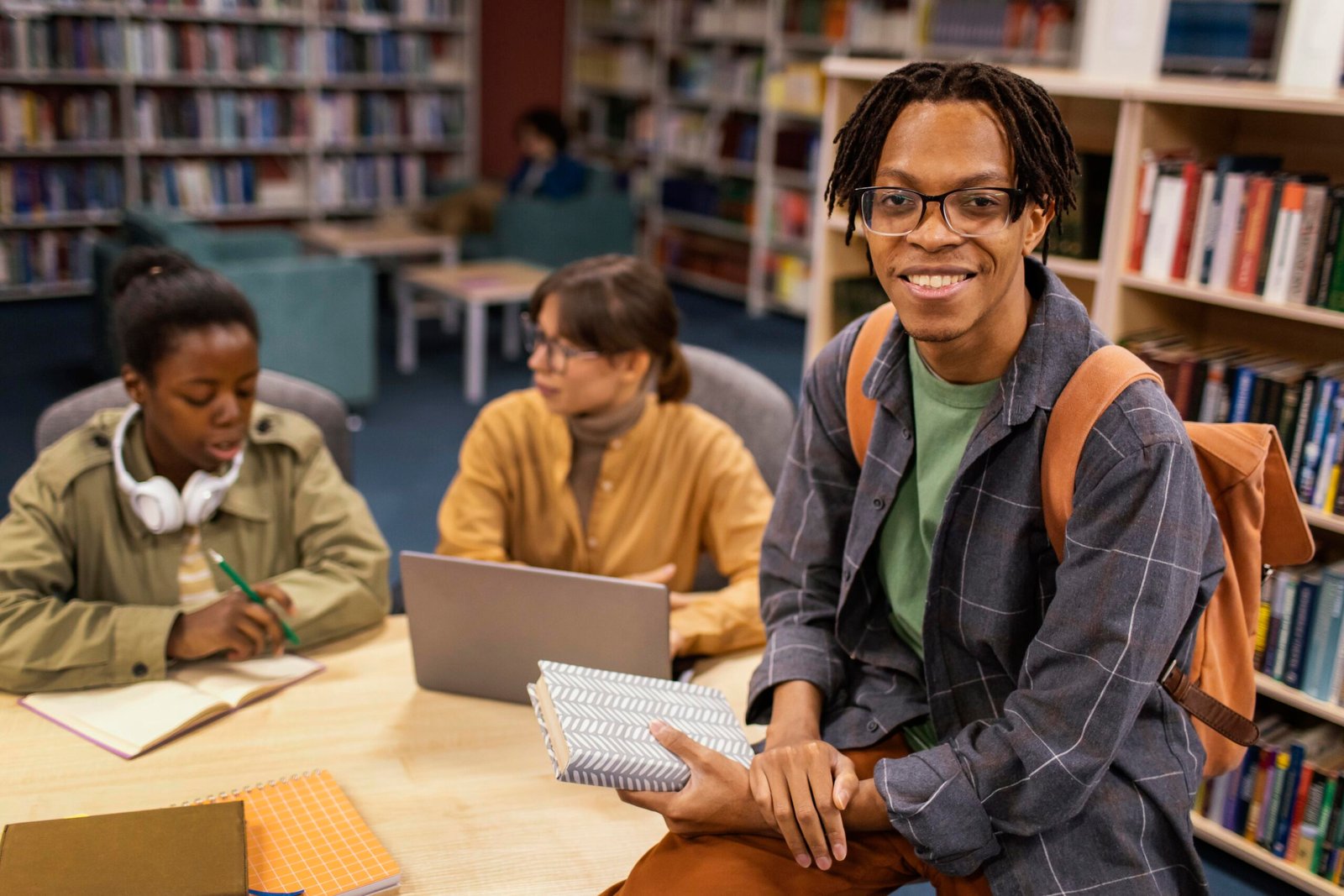 colleagues-studying-together-university-library